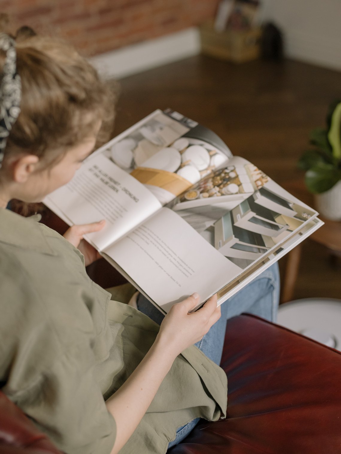 Girl in Gray Jacket Reading Book